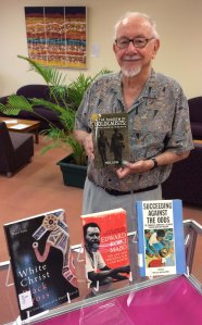 JCU Associate Professor Noel Loos with some of his publications from the NQ Collection, JCU Library Special Collections.